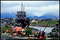 Retired fishing boat with a pile of marine gear on the Spit. Homer, Alaska, USA ( color)