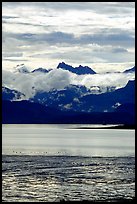 Low clouds hanging over Kenai Mountains across Katchemak Bay. Homer, Alaska, USA ( color)
