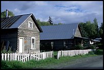 White picket fence and wooden houses. Hope,  Alaska, USA (color)