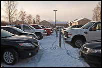 Cars with block engine heaters connected to plugs. Fairbanks, Alaska, USA (color)