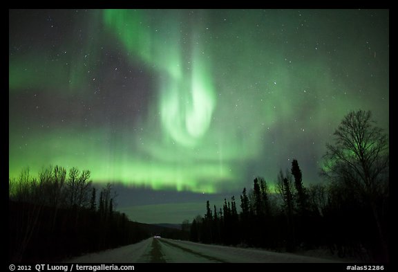 Aurora curtains above road. Alaska, USA