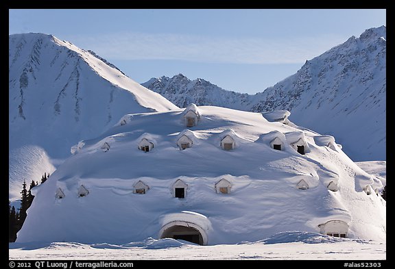 Snow-covered dome-shaped building. Alaska, USA (color)