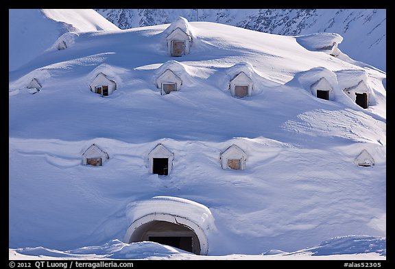 Snow-covered igloo-shaped building. Alaska, USA (color)
