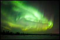 Magnetic storm in sky above snowy meadow. Alaska, USA