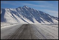 Frozen James Dalton Highway below Arctic Mountains. Alaska, USA (color)