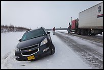Car stuck in snow along Dalton Highway. Alaska, USA (color)