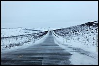 Windblown drifted snow across Dalton Highway. Alaska, USA (color)