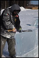 Ice artist carving with saw. Fairbanks, Alaska, USA (color)