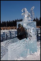 Girl on ice sculpture, George Horner Ice Park. Fairbanks, Alaska, USA