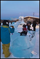Children playing on ice sculptures, Ice Alaska. Fairbanks, Alaska, USA