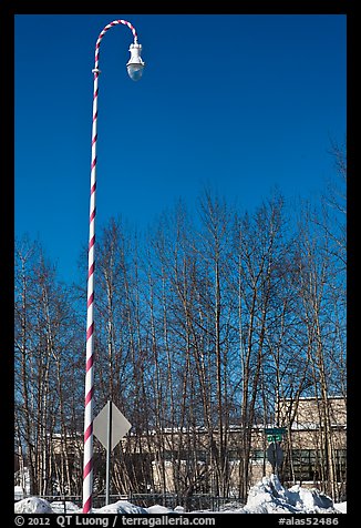 Street light decorated with a candy cane motif. North Pole, Alaska, USA