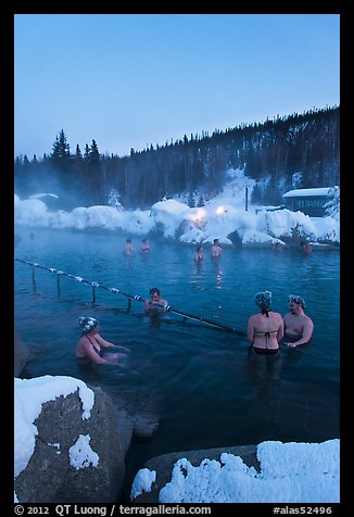 People soak in natural hot springs in winter. Chena Hot Springs, Alaska, USA