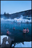 People soak in natural hot springs in winter. Chena Hot Springs, Alaska, USA (color)