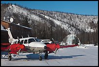 Plane with engine block warmers on frozen runway. Chena Hot Springs, Alaska, USA