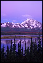 Snowy peaks and lake at dusk. Alaska, USA