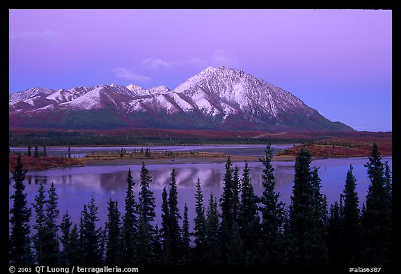 Purple mountains and lake at dusk. Alaska, USA