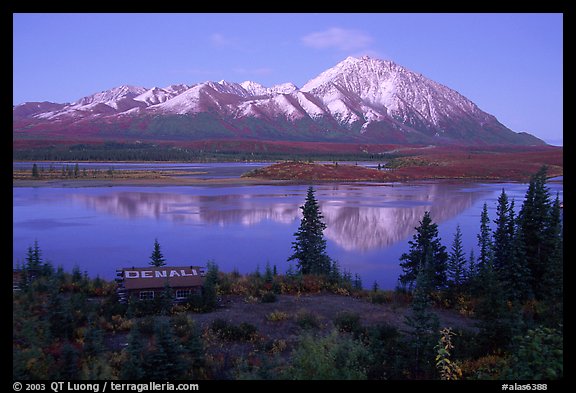 Mountains and lake at dusk, cabin with Denali sign. Alaska, USA (color)