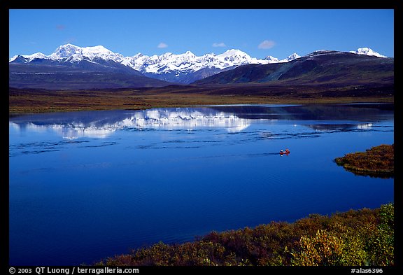 Lake with snowy peaks reflected. Alaska, USA