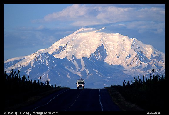 Car on Glenn Highway with Wrangell range peak behind. Alaska, USA
