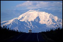 Car on Glenn Highway with Wrangell range peak behind. Alaska, USA (color)