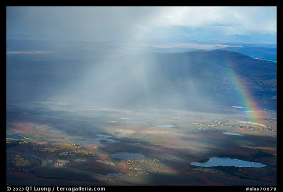 Aerial view of lakes, rainshowers, and rainbow. Alaska, USA
