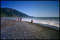 Backpacking on black sand beach, Lost Coast. California, USA (color)