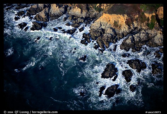 Aerial view of surf and rock. San Mateo County, California, USA