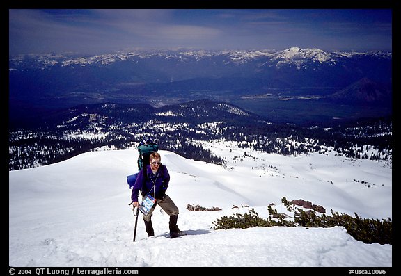 Climber takes a break on the Green Ridge of Mt Shasta. California, USA (color)