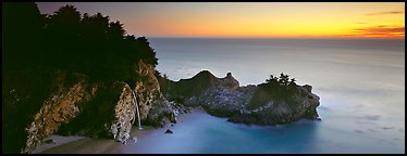 Seascape at sunset with coastal waterfall. Big Sur, California, USA (Panoramic color)