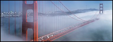 Fog rolling over Golden Gate Bridge. San Francisco, California, USA (Panoramic color)