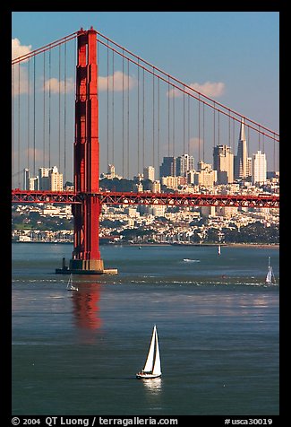 Sailboat, Golden Gate Bridge, and  city skyline, afternoon. San Francisco, California, USA (color)