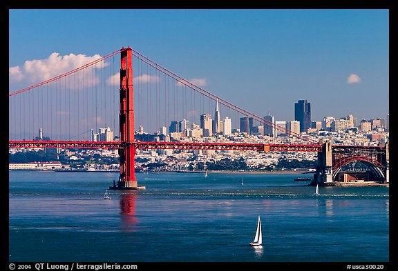 Sailboat, Golden Gate Bridge with city skyline, afternoon. San Francisco, California, USA