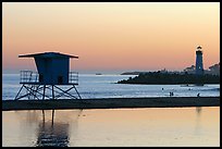 Beach cabin and lighthouse, Twin Lakes State Beach, sunset. Santa Cruz, California, USA (color)