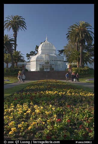 Flower bed and Conservatory of the Flowers, late afternoon, Golden Gate Park. San Francisco, California, USA