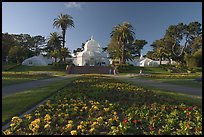 Flower bed and Conservatory of the Flowers, late afternoon, Golden Gate Park. San Francisco, California, USA (color)