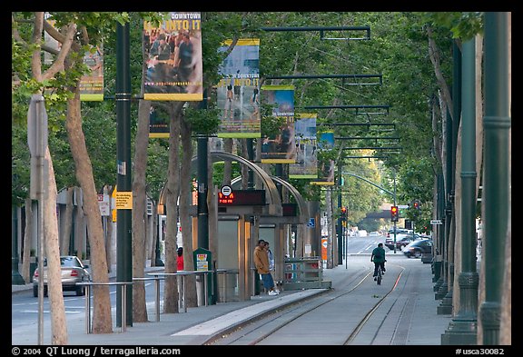Downtown tree-lined street with tram lane. San Jose, California, USA (color)