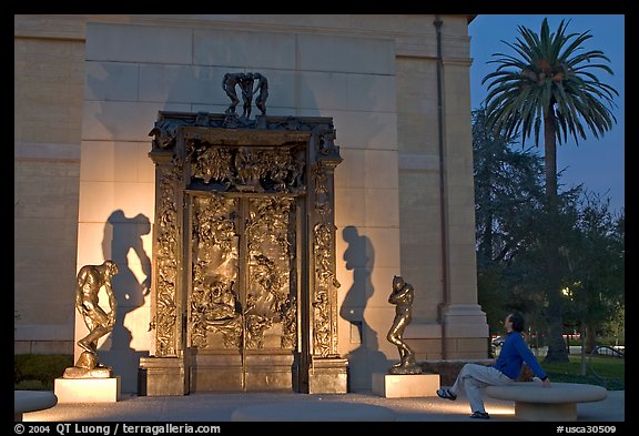 Visitor contemplating Rodin's Gates of Hell in the Rodin sculpture garden. Stanford University, California, USA (color)