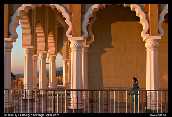 Indian girl running amongst columns of the Sikh Temple. San Jose, California, USA (color)