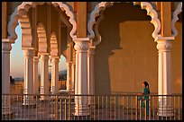 Indian girl running amongst columns of the Sikh Temple. San Jose, California, USA