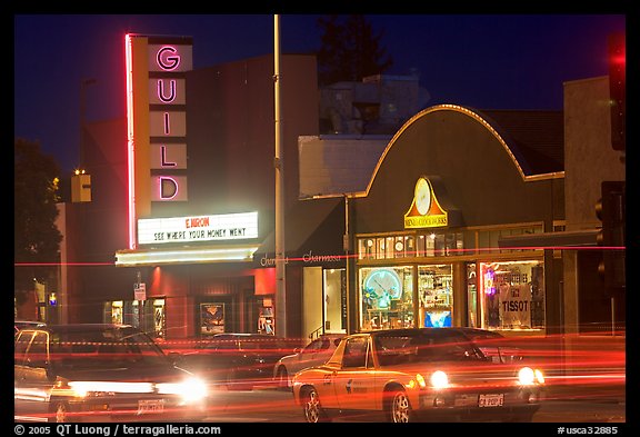 El Camino Real at night, with movie theater and Menlo Clock Works. Menlo Park,  California, USA (color)
