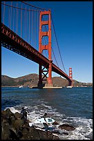 Surfers below the Golden Gate Bridge. San Francisco, California, USA (color)