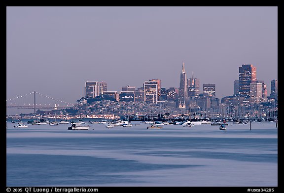 Harbor in Richardson Bay with houseboats and city skyline at dusk. San Francisco, California, USA (color)
