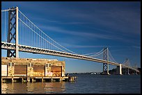 Old pier and Bay Bridge, early morning. San Francisco, California, USA (color)
