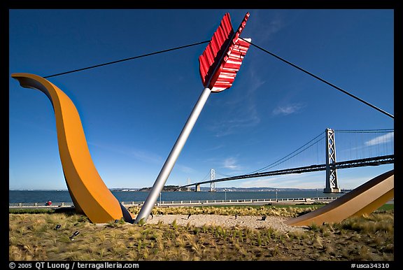 Modern sculputure called Cupid's arrow, framing the Bay Bridge. San Francisco, California, USA (color)