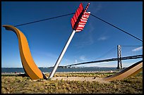 Modern sculputure called Cupid's arrow, framing the Bay Bridge. San Francisco, California, USA (color)