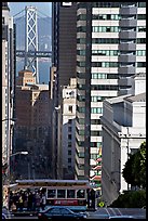 Cable-car, Chinatown, Financial District and Bay Bridge. San Francisco, California, USA