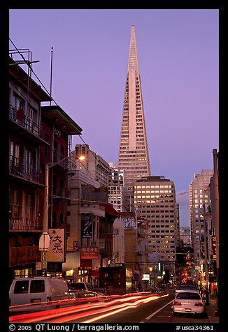 Chinatown street and Transamerica Pyramid, dusk. San Francisco, California, USA