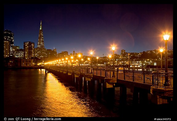 Skyline, Pier 7 lights and reflections at night. San Francisco, California, USA
