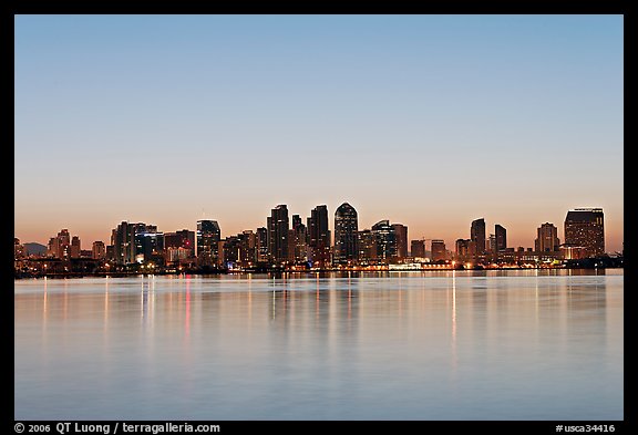 Skyline reflected in the waters of harbor, dawn. San Diego, California, USA