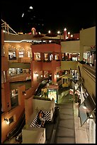 Some of the 140 stores in the Horton Plaza shopping mall at night. San Diego, California, USA